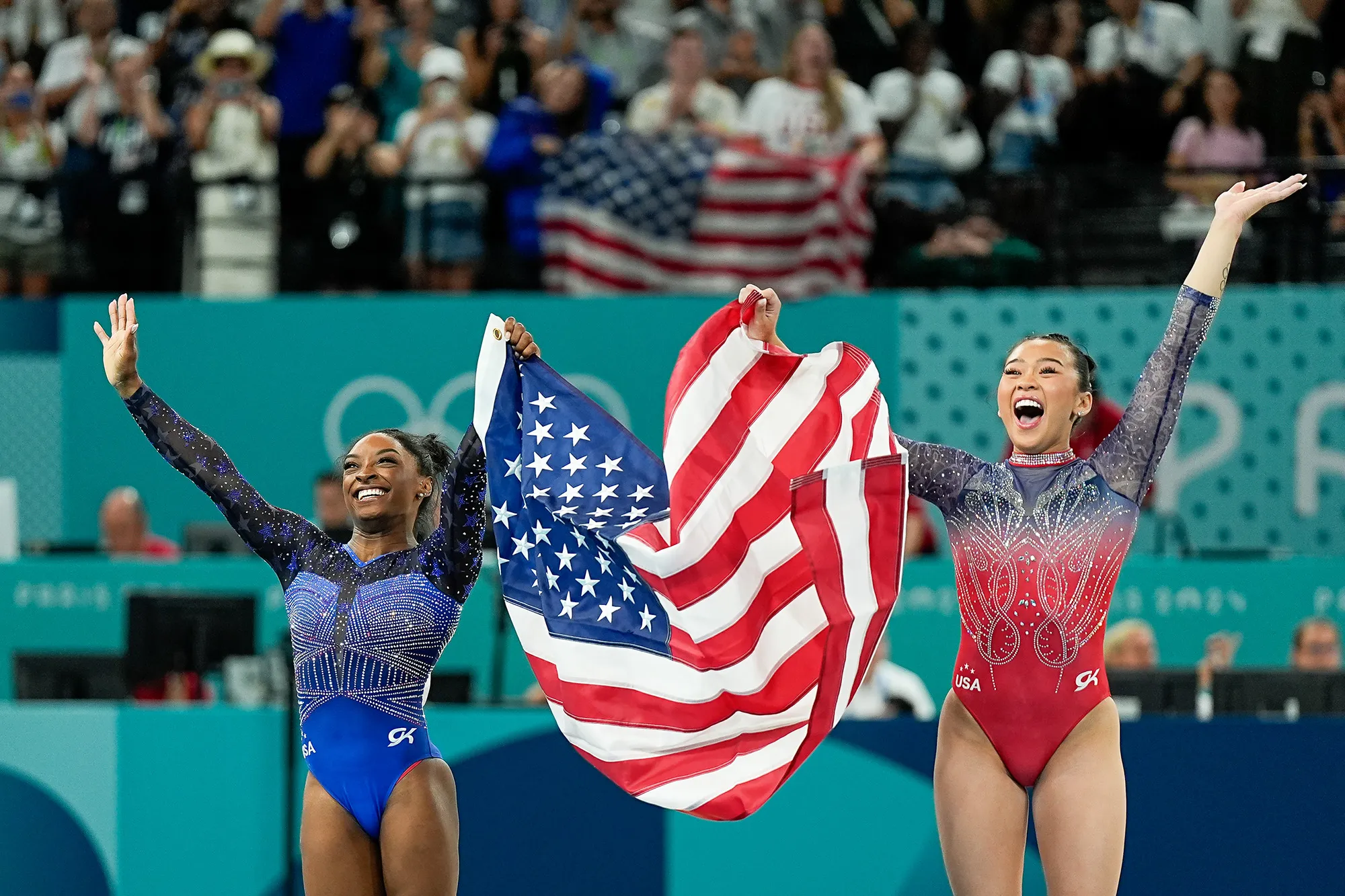 Gymnasts holding American flag