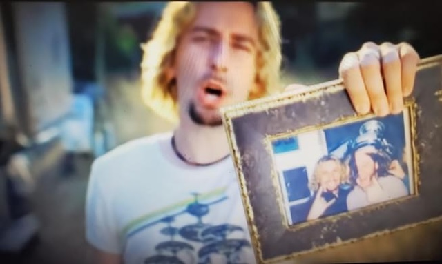 Chad Kroeger holding frame from song Photograph